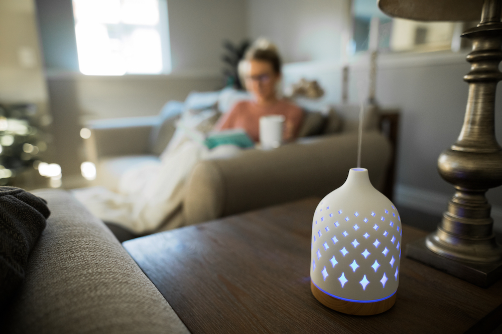Senior relaxing with aromatherapy diffuser