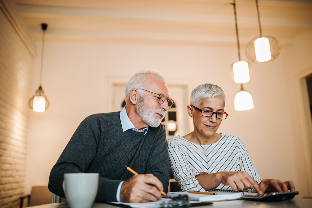 Senior Couple Sitting At Table