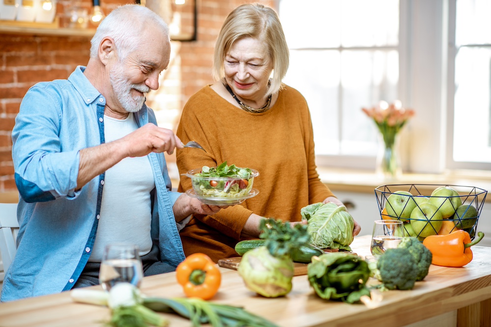 Senior couple eating healthy lunch