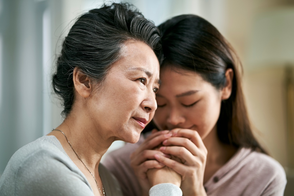 A young woman talking to her mother about moving to a San Juan Capistrano memory care for seniors